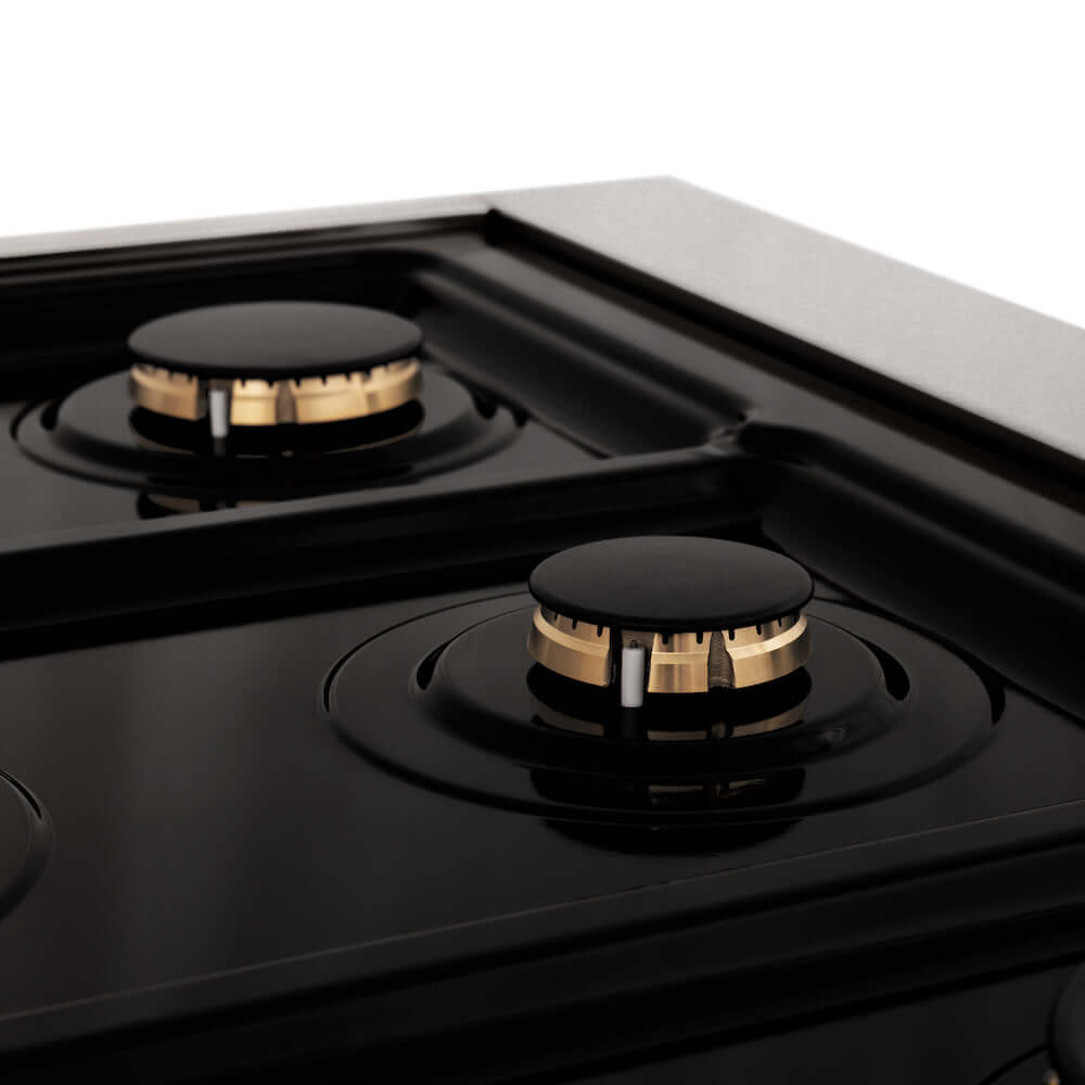 ZLINE Autograph Edition 30 in. 4.0 cu. ft. Dual Fuel Range with Gas Stove and Electric Oven in Fingerprint Resistant Stainless Steel with White Matte Door and Polished Gold Accents (RASZ-WM-30-G) close-up, brass burners on black porcelain cooktop without grates from side.