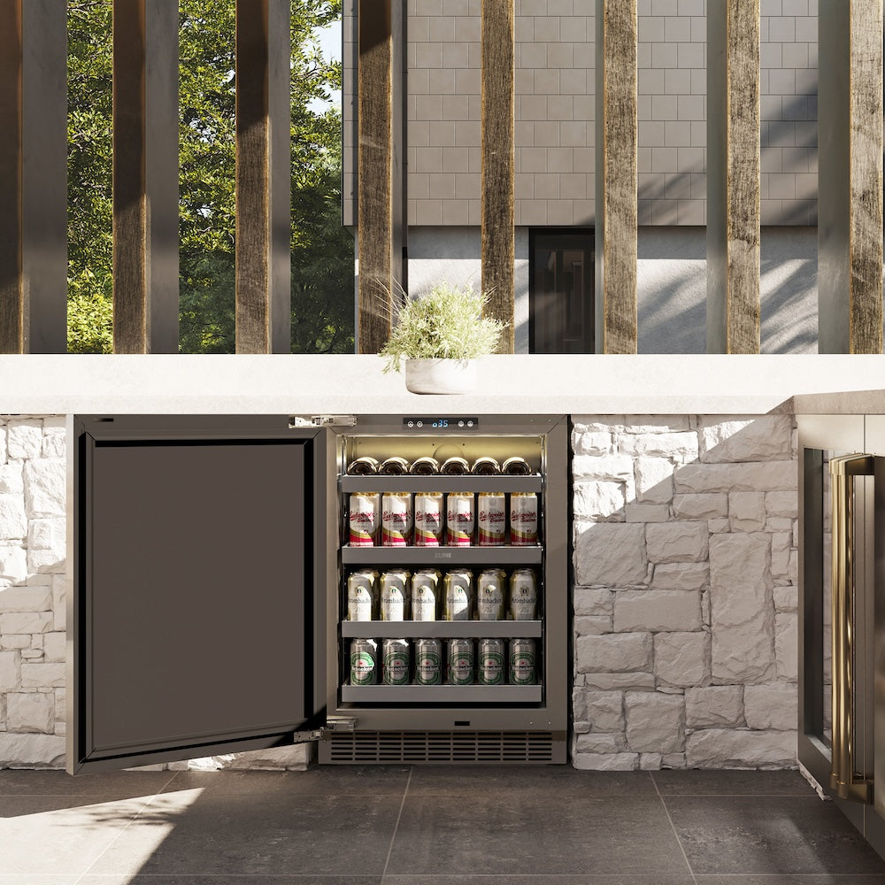 ZLINE Autograph Edition 24 in. Touchstone 151 Can Beverage Fridge With Solid Stainless Steel Door And Polished Gold Handle (RBSOZ-ST-24-G) in outdoor patio area, door open with drinks inside