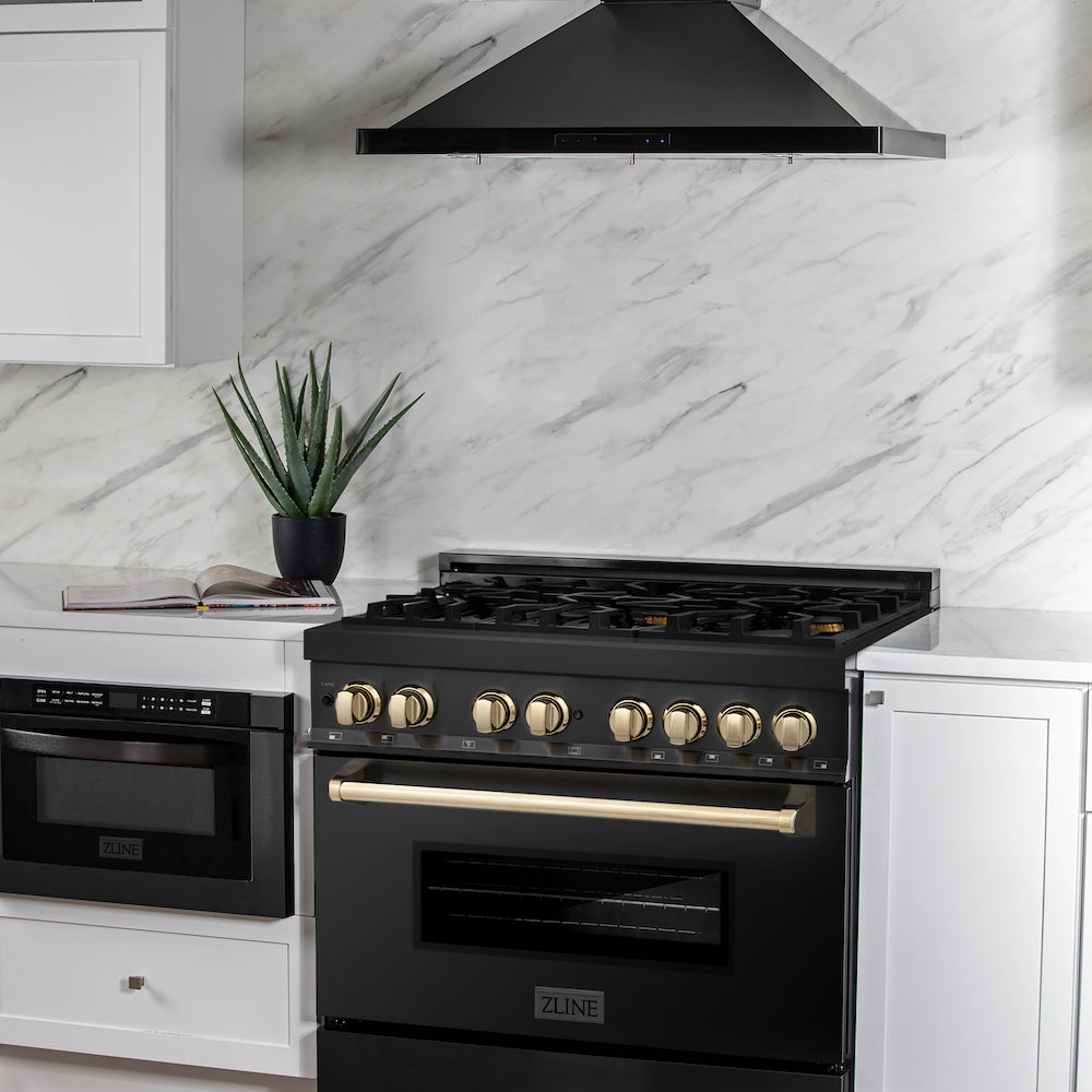 ZLINE Autograph Edition 36 in. 4.6 cu. ft. Dual Fuel Range with Gas Stove and Electric Oven in Black Stainless Steel with Polished Gold Accents (RABZ-36-G) in a luxury cottage-style kitchen with matching range hood and microwave.