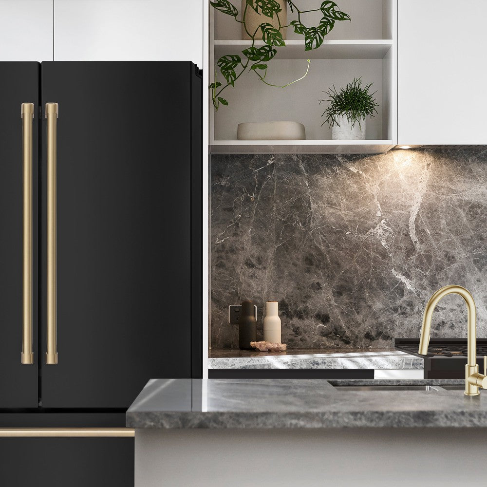 ZLINE Autograph Edition 36 in. 22.5 cu. ft Freestanding French Door Refrigerator with Ice Maker in Fingerprint Resistant Black Stainless Steel with Champagne Bronze Accents (RFMZ-36-BS-CB) in a white luxury kitchen with white marble counters from front.