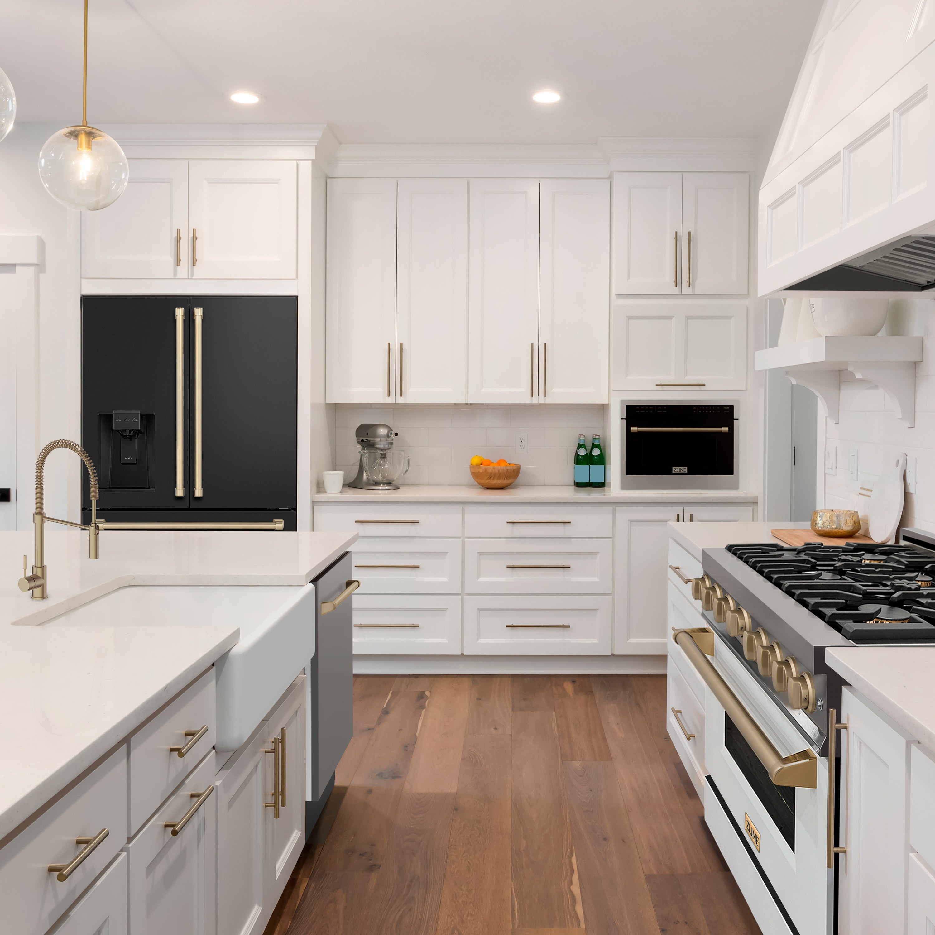 ZLINE appliances with champagne bronze accents in a luxury white farmhouse-style kitchen.