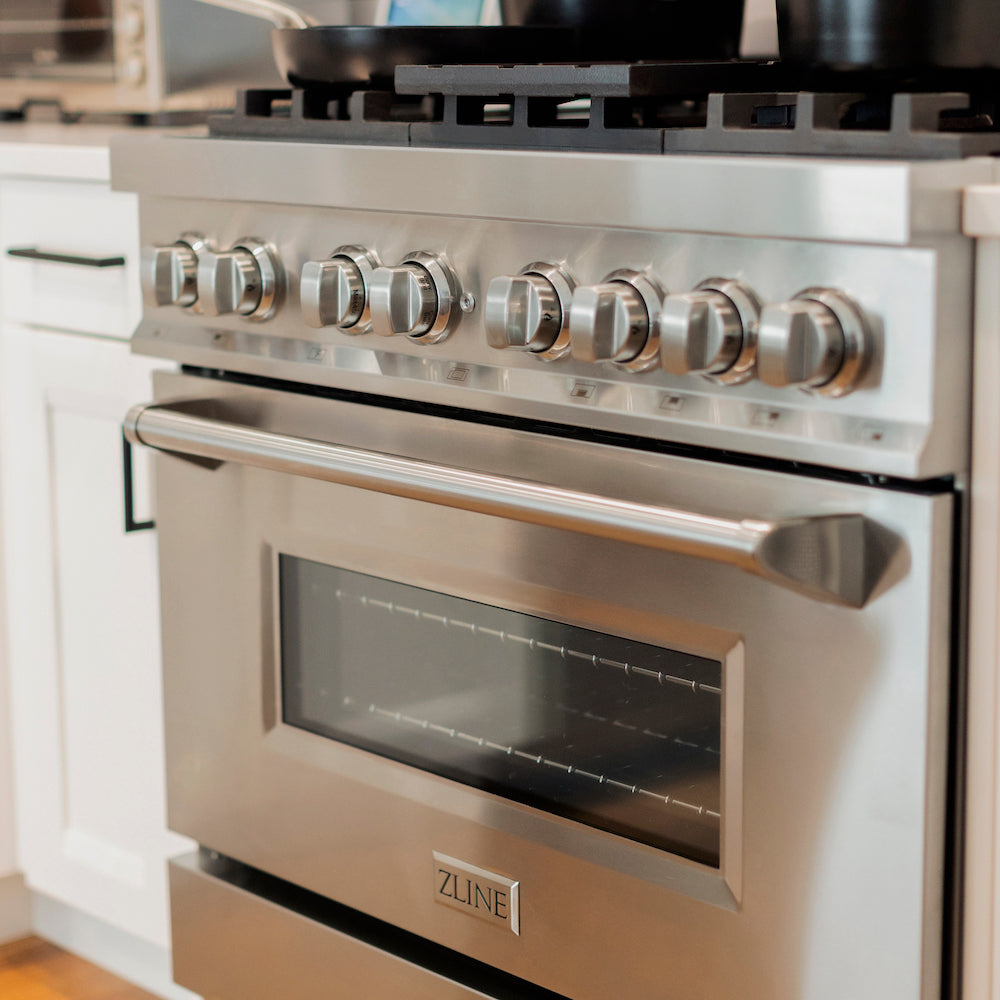 Close up of ZLINE 36 in. Dual Fuel Range with Gas Stove and Electric Oven in Stainless Steel (RA36) in a kitchen.