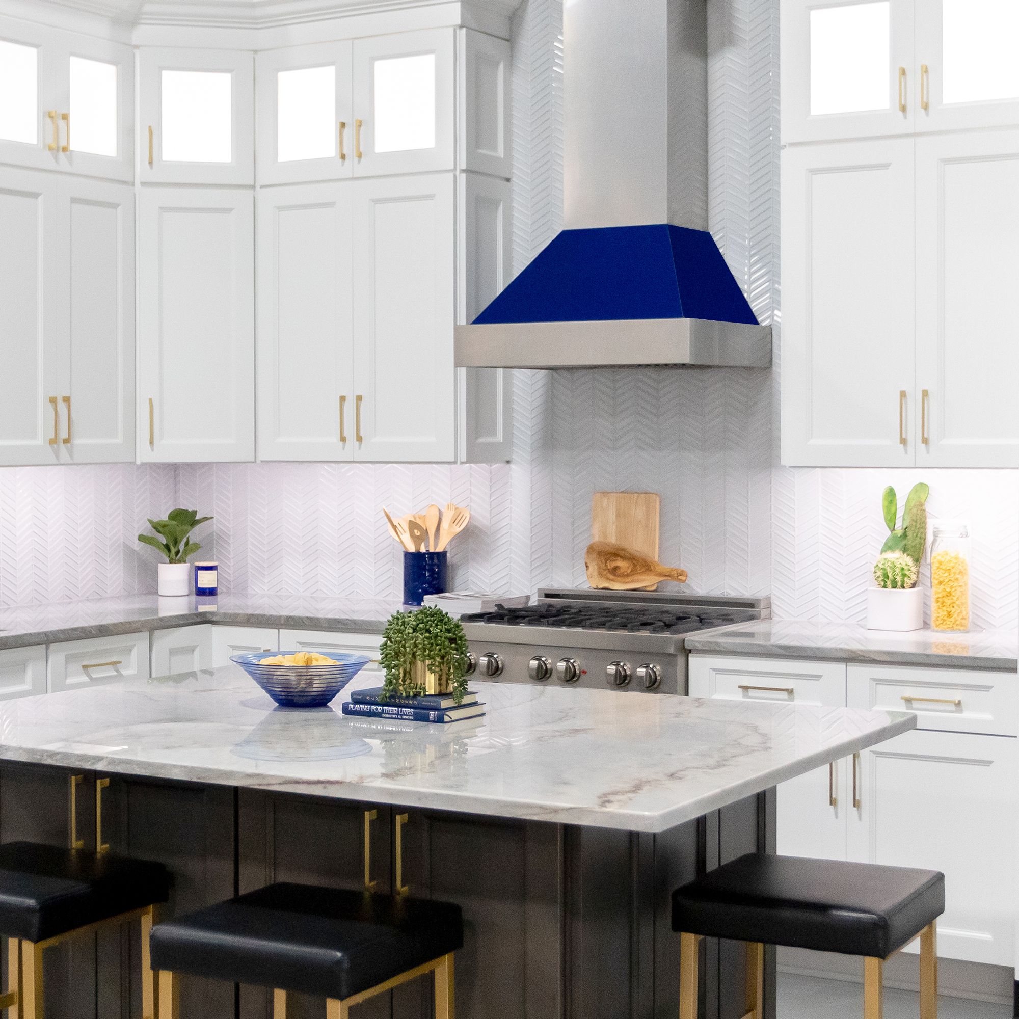ZLINE Ducted Fingerprint Resistant Stainless Steel Range Hood with Blue Gloss Shell (8654BG) with matching blue gloss range in a white cottage-style kitchen from across island.