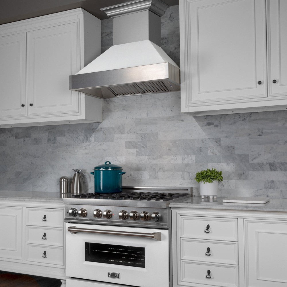 ZLINE Fingerprint Resistant Stainless Steel Range Hood With White Matte Shell (8654WM) with a short chimney above a matching kitchen range from side.