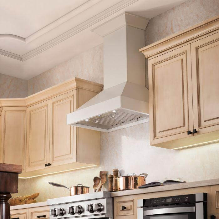 ZLINE Ducted Wooden Wall Mount Range Hood in Cottage White (KBTT) in a farmhouse-style kitchen