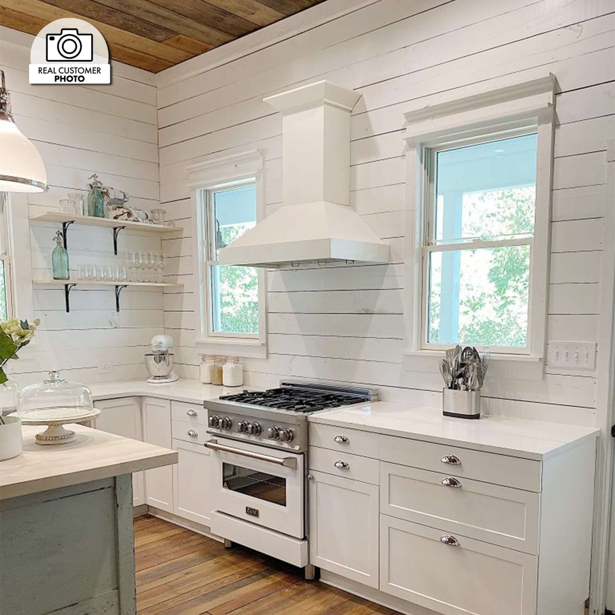 ZLINE Ducted Wooden Wall Mount Range Hood in Cottage White (KBTT) in a compact cottage-style kitchen