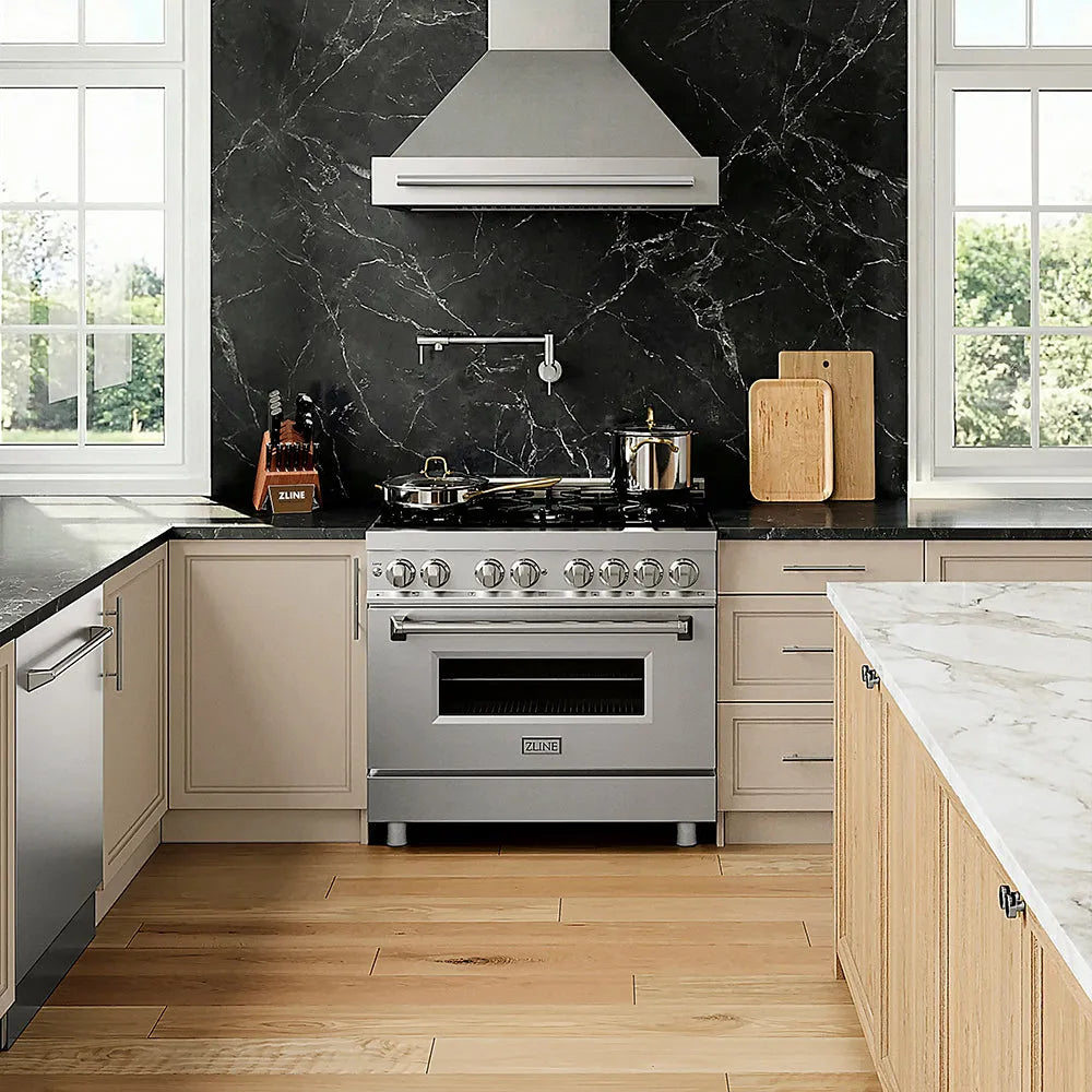 Designer kitchen with ZLINE 36 in. 4.6 cu. ft. Legacy Dual Fuel Range with 6 Burner Gas Cooktop and Electric Convection Oven in Stainless Steel (RA36), marble countertops, and black marble backsplash.