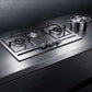 A Fotile EPS Series 31 in. Cooktop with 3 Sealed Burners in Stainless Steel (GAS78307), installed on a dark countertop with a matching pot visible in the background.