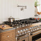 ZLINE 48 in. 6.0 cu. ft. Legacy Dual Fuel Range with Gas Cooktop and 2 Electric Ovens in Stainless Steel with 6 Brass Burners (RA-BR-48) in a luxury kitchen.
