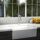 ZLINE Arthur Kitchen Faucet (ATH-KF) Chrome in a modern kitchen with a white farmhouse sink and a window view of greenery.
