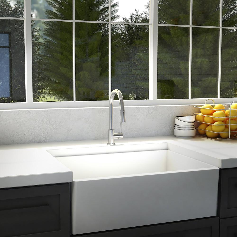 ZLINE Arthur Kitchen Faucet (ATH-KF) Chrome in a modern kitchen with a white farmhouse sink and a window view of greenery.