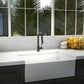 ZLINE Arthur Kitchen Faucet (ATH-KF) Matte Black in a modern kitchen with a white sink and a window view of greenery.