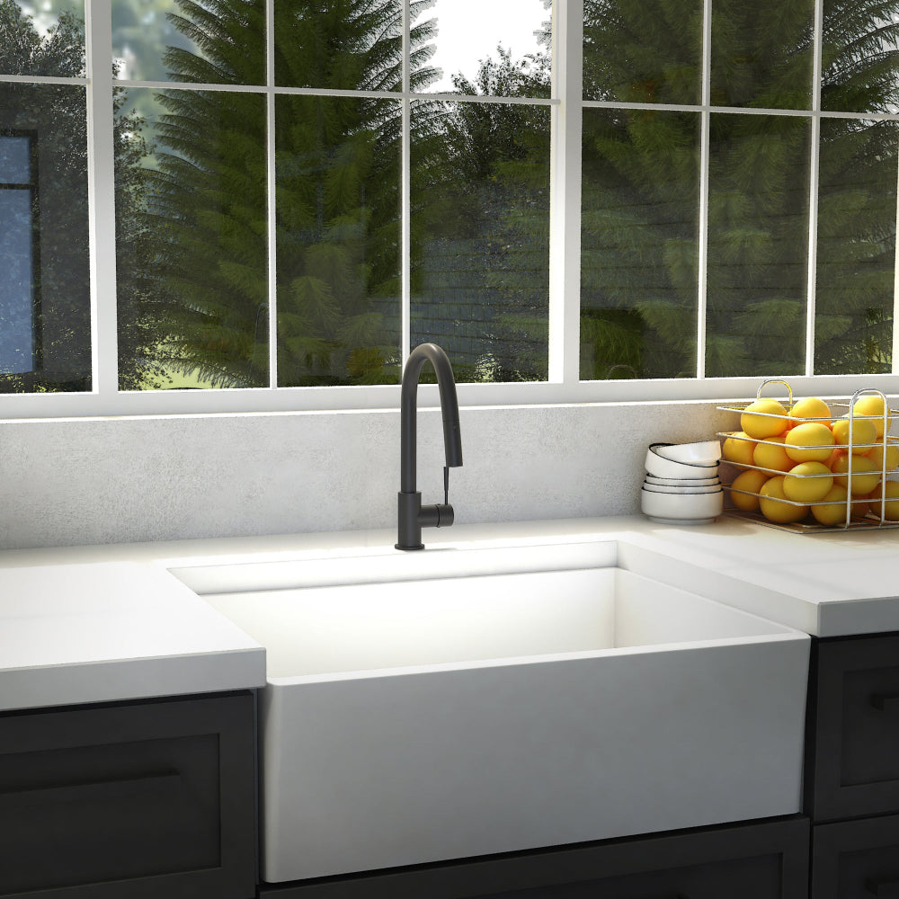 ZLINE Arthur Kitchen Faucet (ATH-KF) Matte Black in a modern kitchen with a white sink and a window view of greenery.