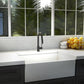 ZLINE Arthur Kitchen Faucet (ATH-KF) Matte Black in a modern kitchen with a white sink and a window view of greenery.