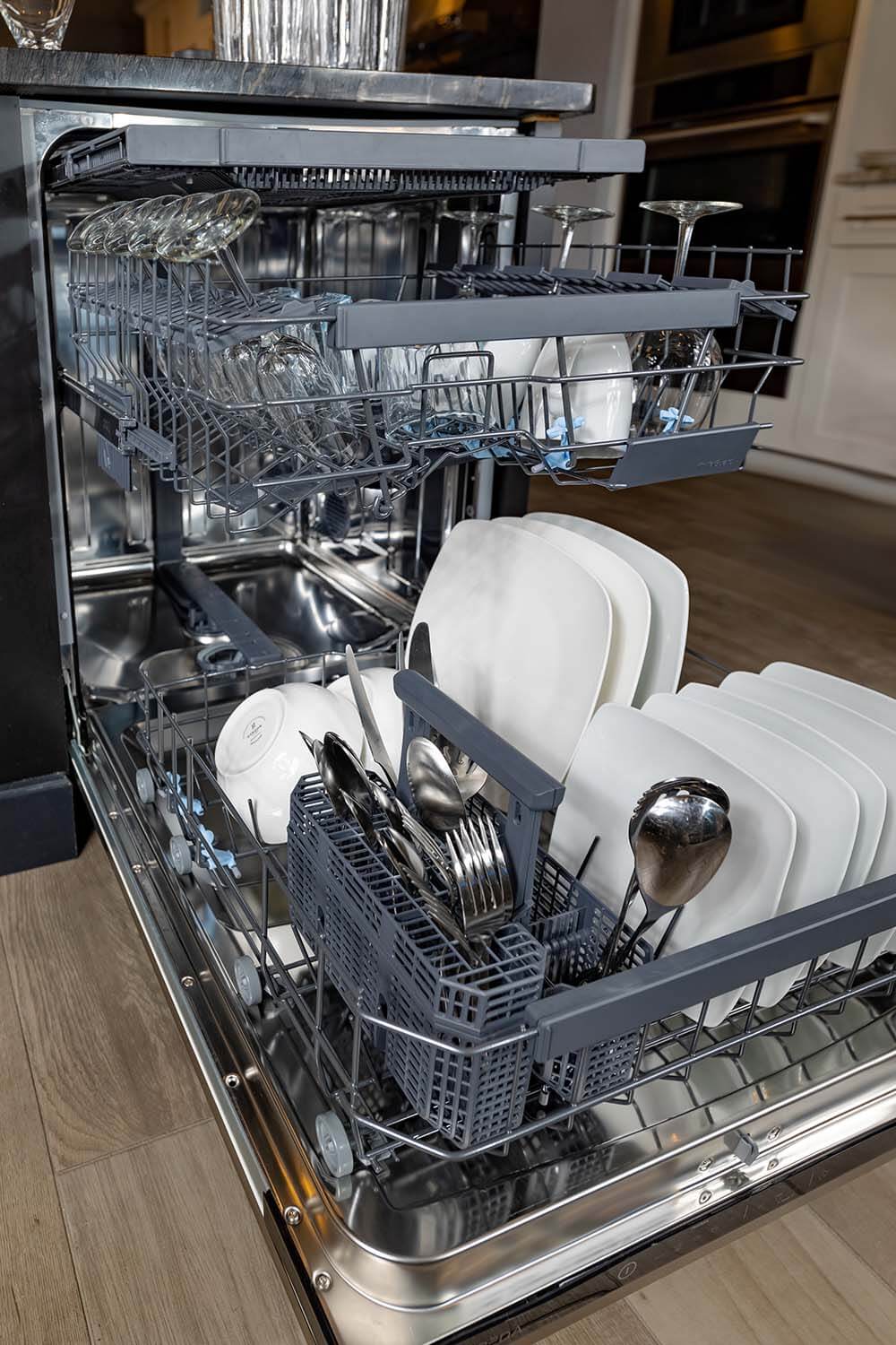 BREDA dishwasher with 3 racks loaded with dishes