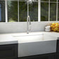 Farmhouse kitchen with a white sink and ZLINE Castor Kitchen Faucet in Brushed Nickel (CAS-KF-BN), surrounded by windows with a view of greenery.