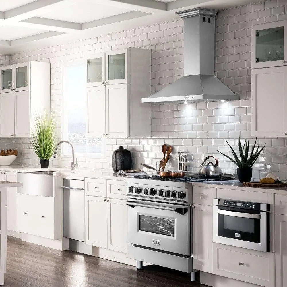 ZLINE Convertible Vent Wall Mount Range Hood in Stainless Steel with Crown Molding (KBCRN) in a farmhouse-style kitchen with Matching ZLINE Range and ZLINE Microwave