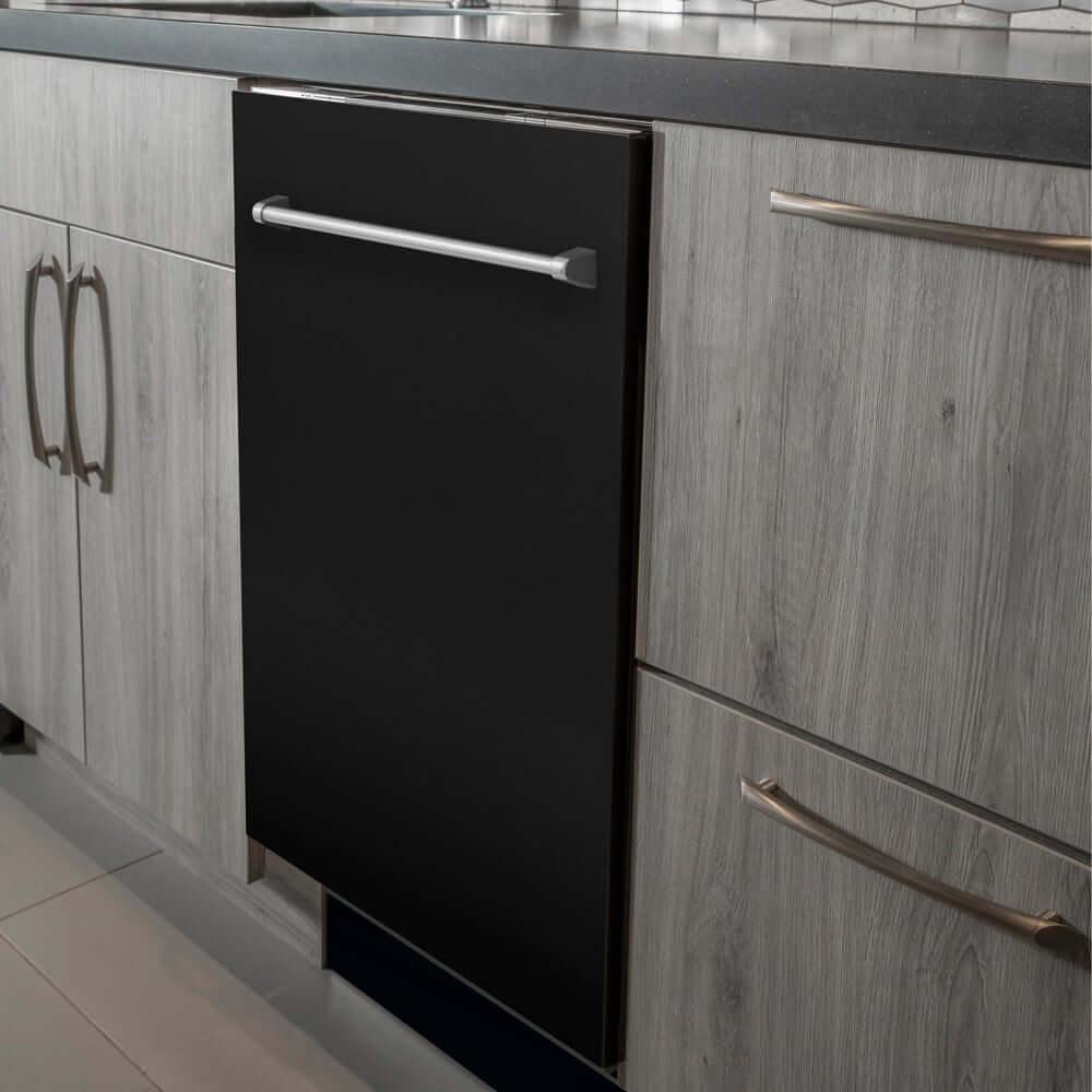 ZLINE 24 in. Black Matte Top Control Built-In Dishwasher with Stainless Steel Tub and Traditional Style Handle, 52dBa (DW-BLM-24) in a modern-style kitchen with grey cabinets and dark countertops.