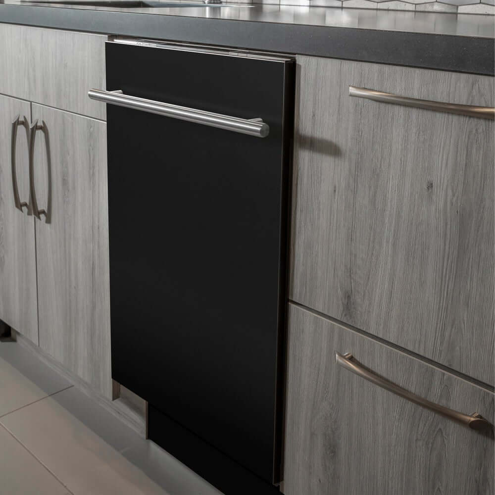 ZLINE 24 in. Black Matte Top Control Built-In Dishwasher with Stainless Steel Tub and Modern Style Handle, 52dBa (DW-BLM-H-24) in a modern-style kitchen with grey cabinets and dark countertops.