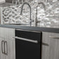 ZLINE 24 in. Black Matte Top Control Built-In Dishwasher with Stainless Steel Tub and Modern Style Handle, 52dBa (DW-BLM-H-24) in a modern-style kitchen with grey cabinets and dark countertops.