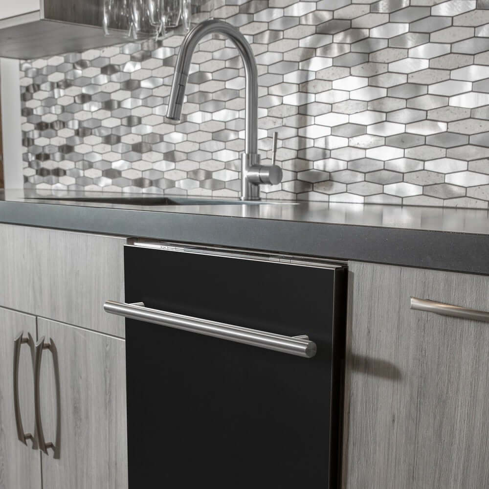 ZLINE 24 in. Black Matte Top Control Built-In Dishwasher with Stainless Steel Tub and Modern Style Handle, 52dBa (DW-BLM-H-24) in a modern-style kitchen with grey cabinets and dark countertops.