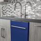 ZLINE 24 in. Blue Matte Top Control Built-In Dishwasher with Stainless Steel Tub and Traditional Style Handle, 52dBa (DW-BM-24) in a modern-style kitchen with grey cabinets and dark countertops.