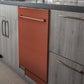 ZLINE 24 in. Copper Top Control Built-In Dishwasher with Stainless Steel Tub and Traditional Style Handle, 52dBa (DW-C-H-24) in a modern-style kitchen with grey cabinets and dark countertops.