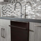 ZLINE 24 in. Oil-Rubbed Bronze Top Control Built-In Dishwasher with Stainless Steel Tub and Modern Style Handle, 52dBa (DW-ORB-24) in a modern-style kitchen with grey cabinets and dark countertops.