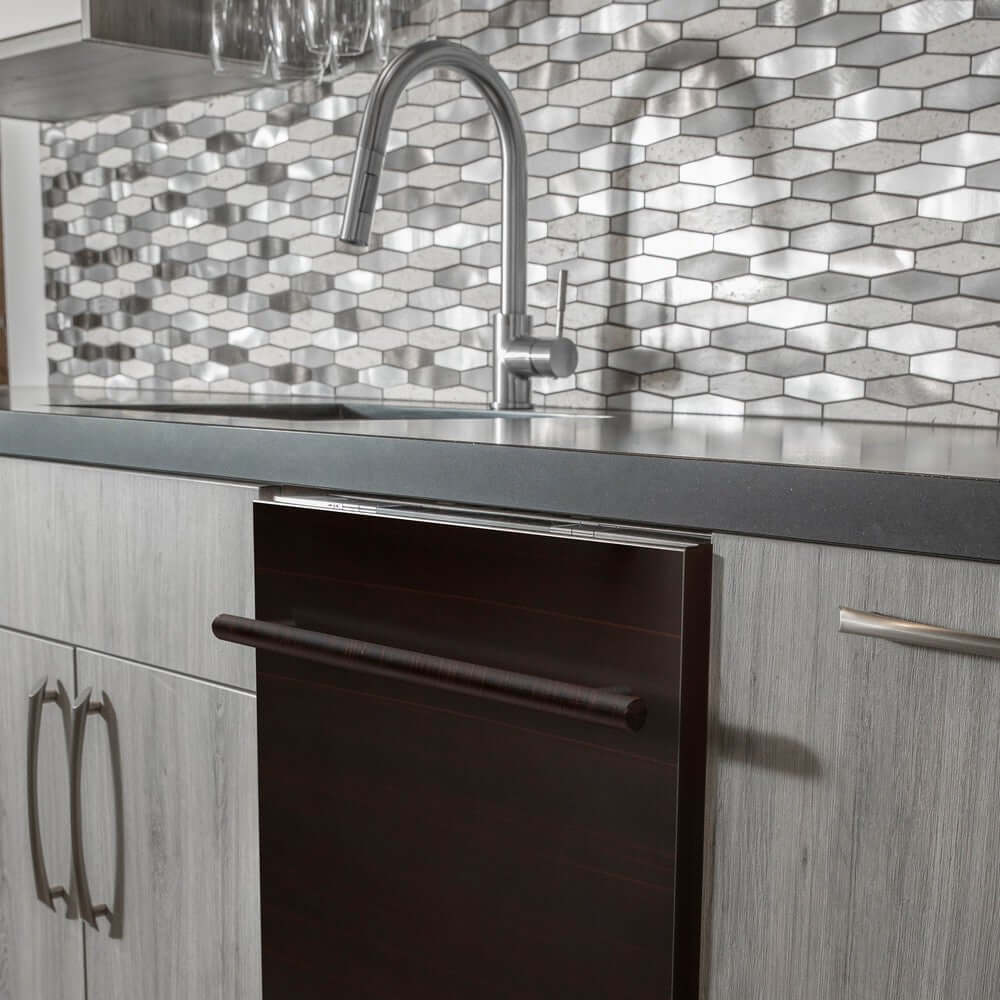 ZLINE 24 in. Oil-Rubbed Bronze Top Control Built-In Dishwasher with Stainless Steel Tub and Modern Style Handle, 52dBa (DW-ORB-24) in a modern-style kitchen with grey cabinets and dark countertops.