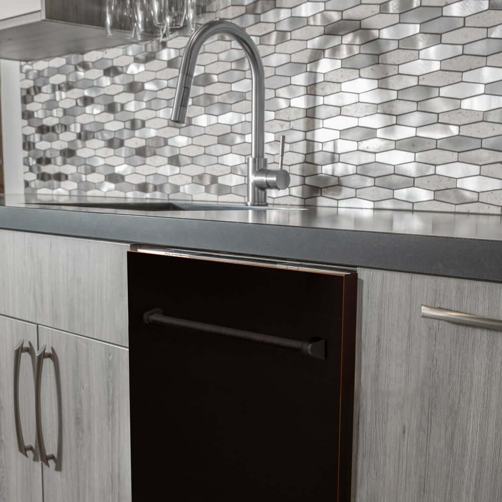 ZLINE 24 in. Oil-Rubbed Bronze Top Control Built-In Dishwasher with Stainless Steel Tub and Traditional Style Handle, 52dBa (DW-ORB-H-24) in a modern-style kitchen with grey cabinets and dark countertops.
