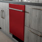 ZLINE 24 in. Red Gloss Top Control Built-In Dishwasher with Stainless Steel Tub and Modern Style Handle, 52dBa (DW-RG-H-24) in a modern-style kitchen with grey cabinets and dark countertops.