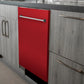 ZLINE 24 in. Red Matte Top Control Built-In Dishwasher with Stainless Steel Tub and Traditional Style Handle, 52dBa (DW-RM-24) in a modern-style kitchen with grey cabinets and dark countertops.