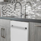 ZLINE 24 in. White Matte Top Control Built-In Dishwasher with Stainless Steel Tub and Traditional Style Handle, 52dBa (DW-WM-24) in a modern-style kitchen with grey cabinets and dark countertops.