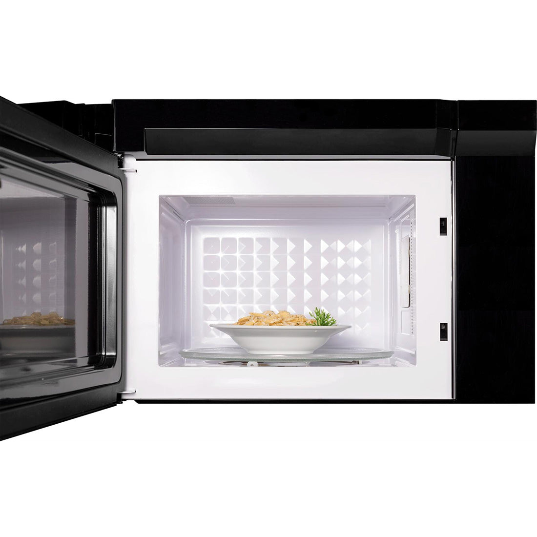 Forté 24 in. 1.3 cu. ft. Over the Range Microwave in Stainless Steel front with door open and food inside.