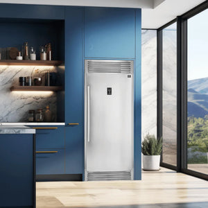 Forno Rizzuto 32 in. 13.8 cu.ft. Interchangeable Refrigerator to Freezer with Right Side Door and Decorative Grill in Stainless Steel (FFFFD1933-32RS) in a kitchen with blue cabinets and a large window.