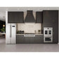 Forno Salerno - 33 in. 15.6 cu. ft. Side by Side Counter Depth Refrigerator in Stainless Steel (FFRBI1805-33SB) in a kitchen with dark cabinets, stainless steel appliances, and a light-colored backsplash.