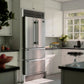 Forno Moena 36 in. 19 cu. ft. French Door Counter Depth Refrigerator with Decorative Grill Trim Kit in Stainless Steel (FFRBI1820-40SG) in a modern kitchen with white cabinets and a window.