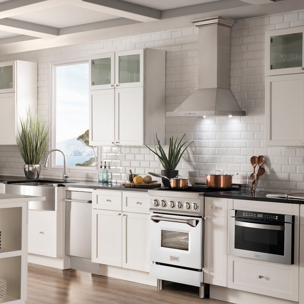 ZLINE 24 in. 2.8 cu. ft. Induction Range with a 4 Element Stove and Electric Oven in White Matte (RAIND-WM-24) in a luxury-style kitchen with matching appliances.