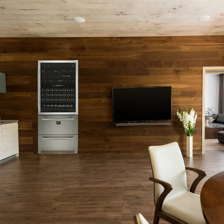 Forno Capraia 30 in. Dual Zone Wine Cellar - 144 Bottles 6.25 cu. ft. (FWCDR6661-30S) in a modern living room with TV and chair against a wooden wall.