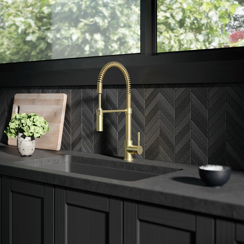 ZLINE Sierra Kitchen Faucet (SRA-KF) with Champagne Bronze Finish in a modern kitchen with black counters