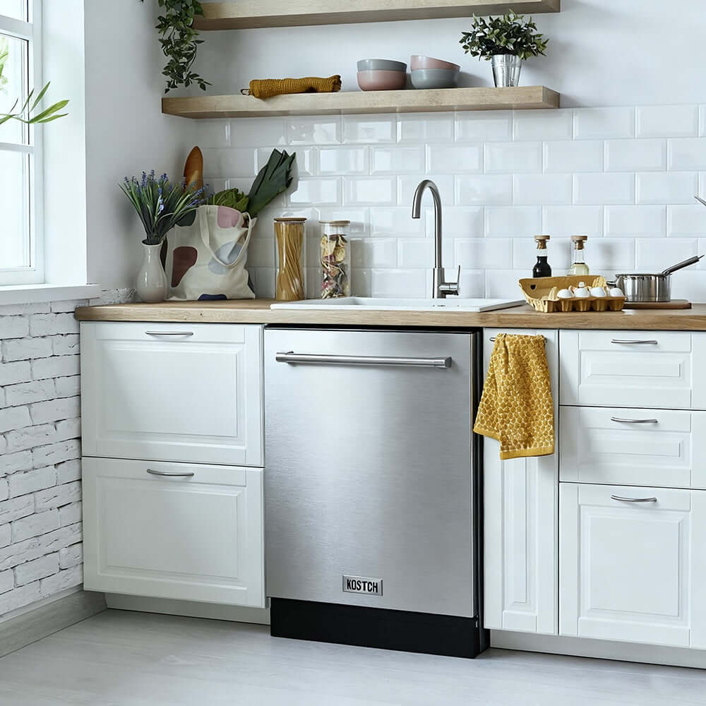 Modern kitchen with KOSTCH 24 in. Top Control Tall Tub Built-In Dishwasher with 3rd Rack in Stainless Steel, 47dBA (KOS-24DWH06H-S), white cabinets, and decorative elements.