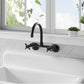 Kingston Brass Concord 8 in. Adjustable Center Wall Mount Kitchen Faucet (KS414) Matte Black on a white kitchen sink with a window and plants in the background