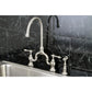 Kingston Brass English Country Kitchen Bridge Faucet with Brass Sprayer (KS7792ALBS) Brushed Nickel on a black marble backsplash