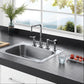 Kingston Brass Concord Two-Handle Bridge Kitchen Faucet with Brass Sprayer (KS8281DLBS) Polished Chrome in a modern kitchen with stainless steel sink and black countertop