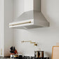 ZLINE Autograph Edition 36 in. Stainless Steel Range Hood with Stainless Steel Shell and Handle (8654STZ-36) in a luxury farmhouse-style kitchen with matching appliances and fixtures from side.