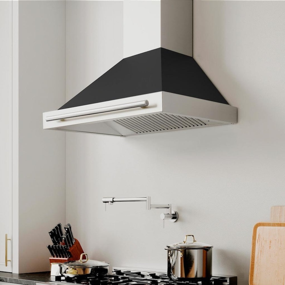 ZLINE 30 in. Convertible Stainless Steel Range Hood with Black Matte Shell and Stainless Steel Handle (KB4STX-BLM-30)
in a kitchen above a gas range, pot filler, and knife block