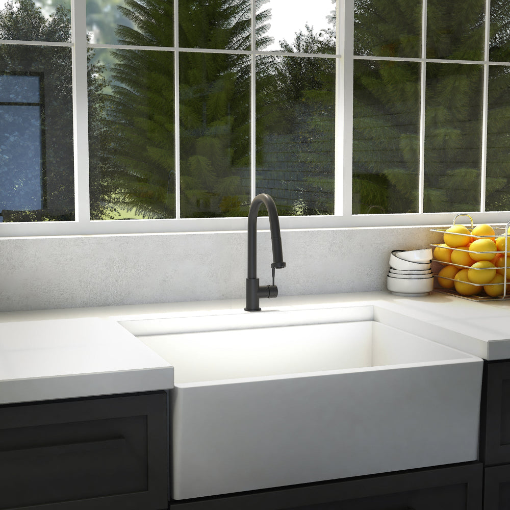 ZLINE Monet Kitchen Faucet (MON-KF) Matte Black in a modern kitchen with a white sink, large window in the background.