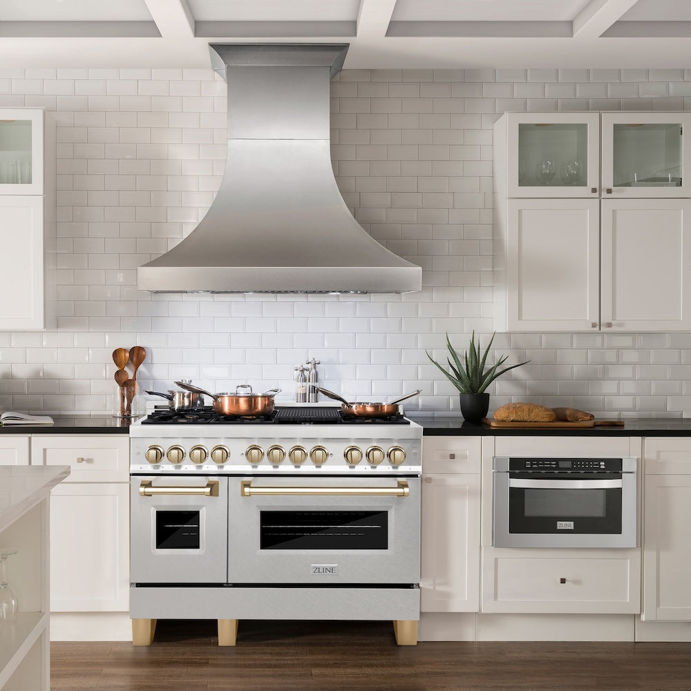ZLINE Autograph Edition 48 in. 6.0 cu. ft. Legacy Dual Fuel Range with 7 Burner Gas Cooktop and 2 Electric Ovens in Satin Stainless Steel and Polished Gold Accents (RASZ-SN-48-G) in a kitchen with white cabinets