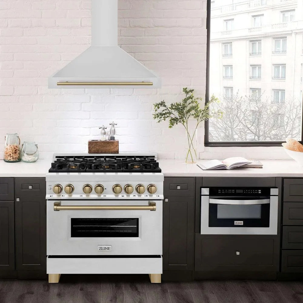 ZLINE Autograph Edition 36 in. Stainless Steel Range Hood with Stainless Steel Shell and Accents (KB4STZ-36) in modern luxury apartment kitchen above matching range.