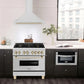 ZLINE Autograph Edition 36 in. Stainless Steel Range Hood with Stainless Steel Shell and Accents (KB4STZ-36) in modern luxury apartment kitchen above matching range.
